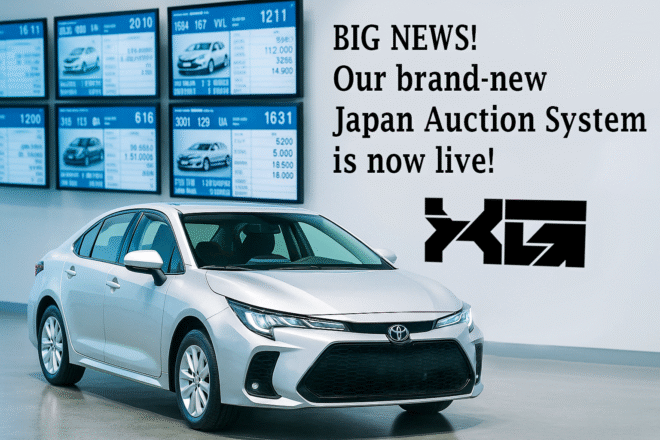 Silver Toyota sedan inside a Japanese car auction hall with live auction monitors in the background